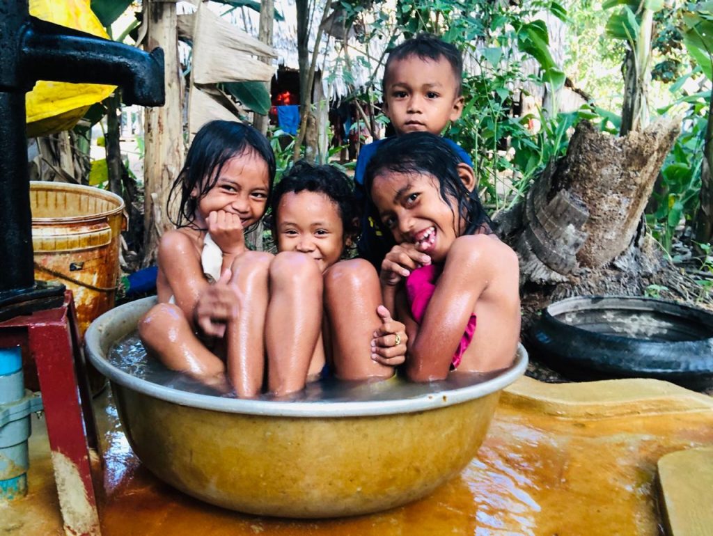 Kids posing in the well