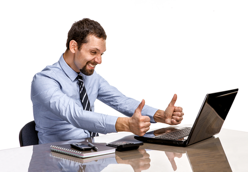 Man giving thumbs up to his computer